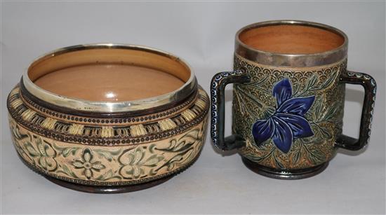 A Doulton Lambeth silver-mounted loving cup by Louisa J Davies and two similar fruit bowls, one by Louisa E. Edwards loving cup height